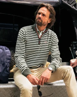 Grüne gestreifte Langarmpolo mit halbem Reißverschluss