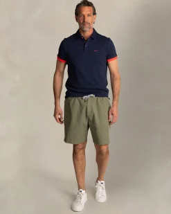 Marineblaues Poloshirt mit Blattmuster