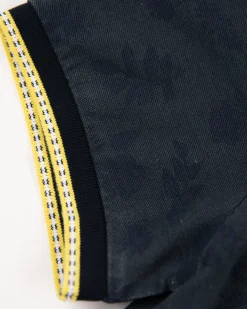 Marineblaues Poloshirt mit Blattdruck